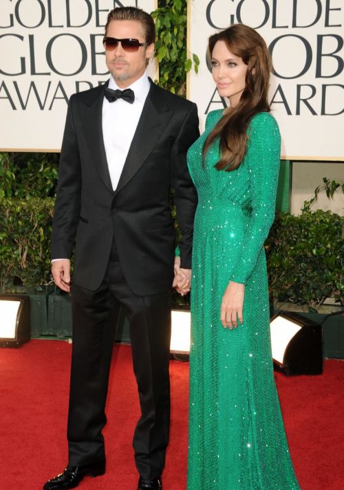 Angelina Jolie and Brad Pitt walk the red carpet at the 2011 Golden Globe Awards