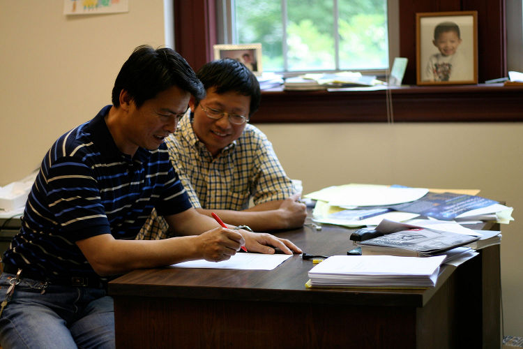 Sichuan University professor Tian Ma, left, and IU Department of Mathematics professor Shouhong Wang have developed a unified theory of dark matter and dark energy